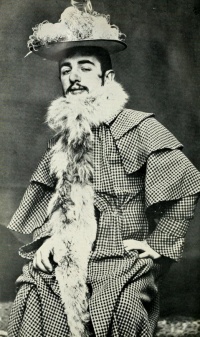 This page Man is part of the gender series.Illustration: Toulouse-Lautrec wearing Jane Avril's Feathered Hat and Boa (ca. 1892), photo Maurice Guibert.